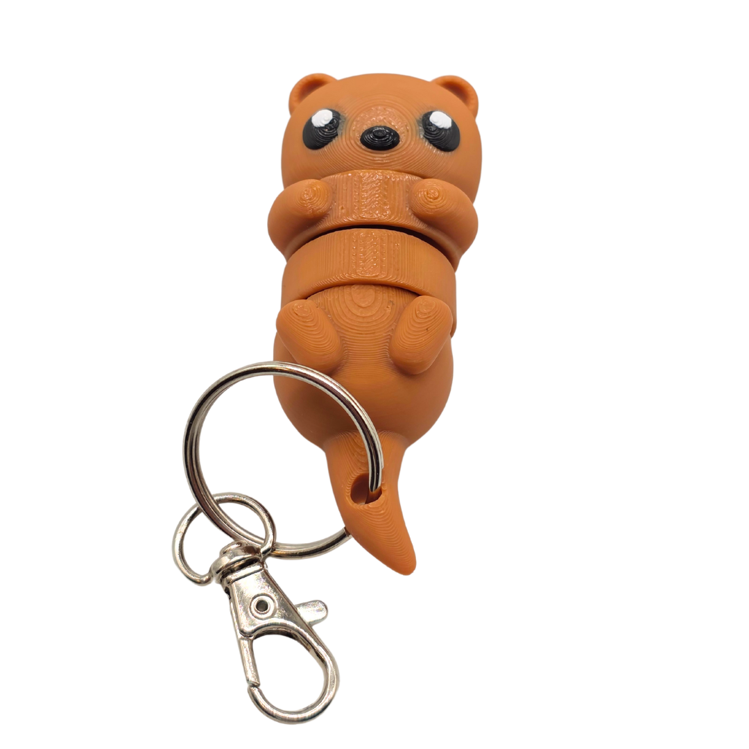 Ein kleiner Otter der als Schlüsselanhänger fungiert.