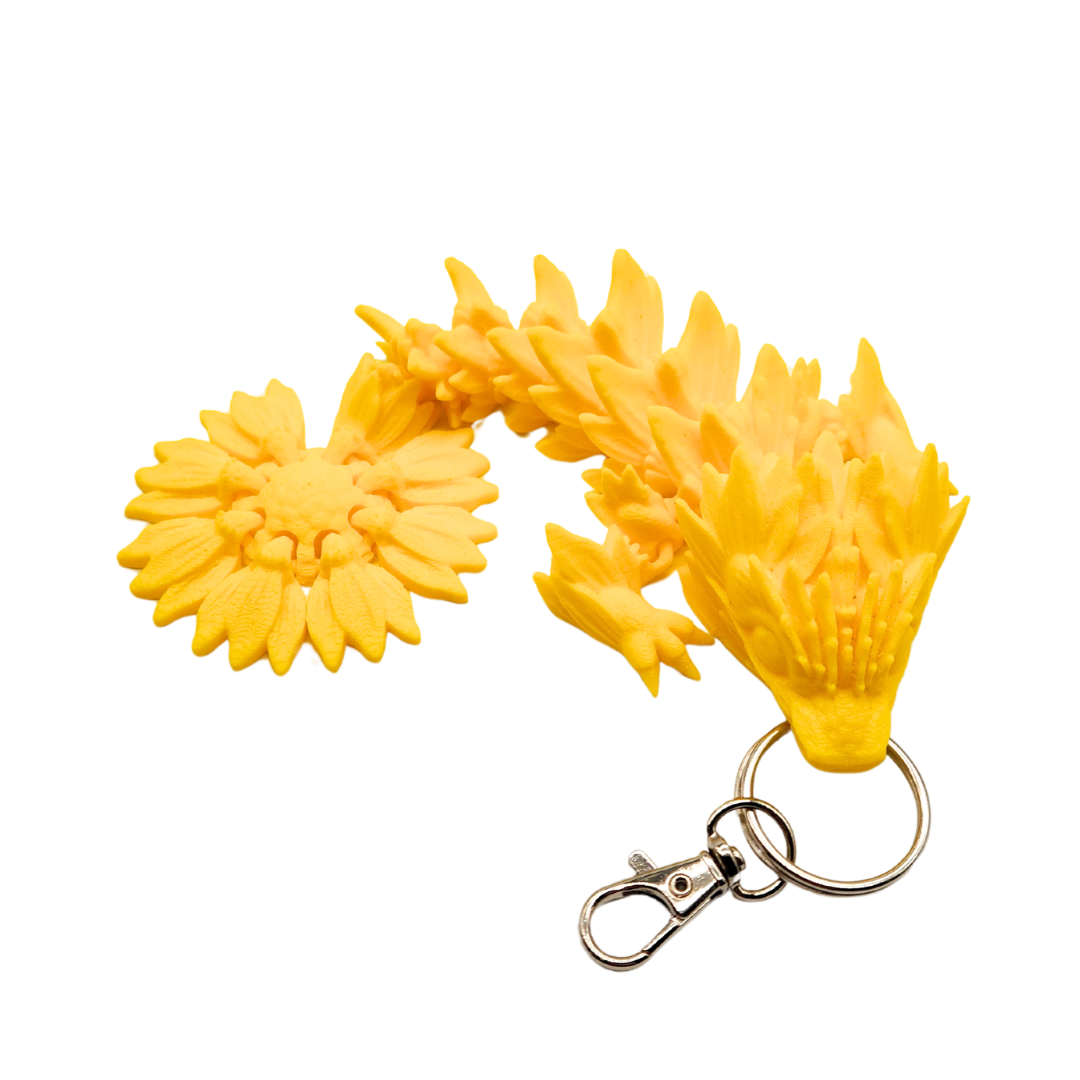 Ein Drachen Anhänger mit einem Sonnenblumen Schwanz